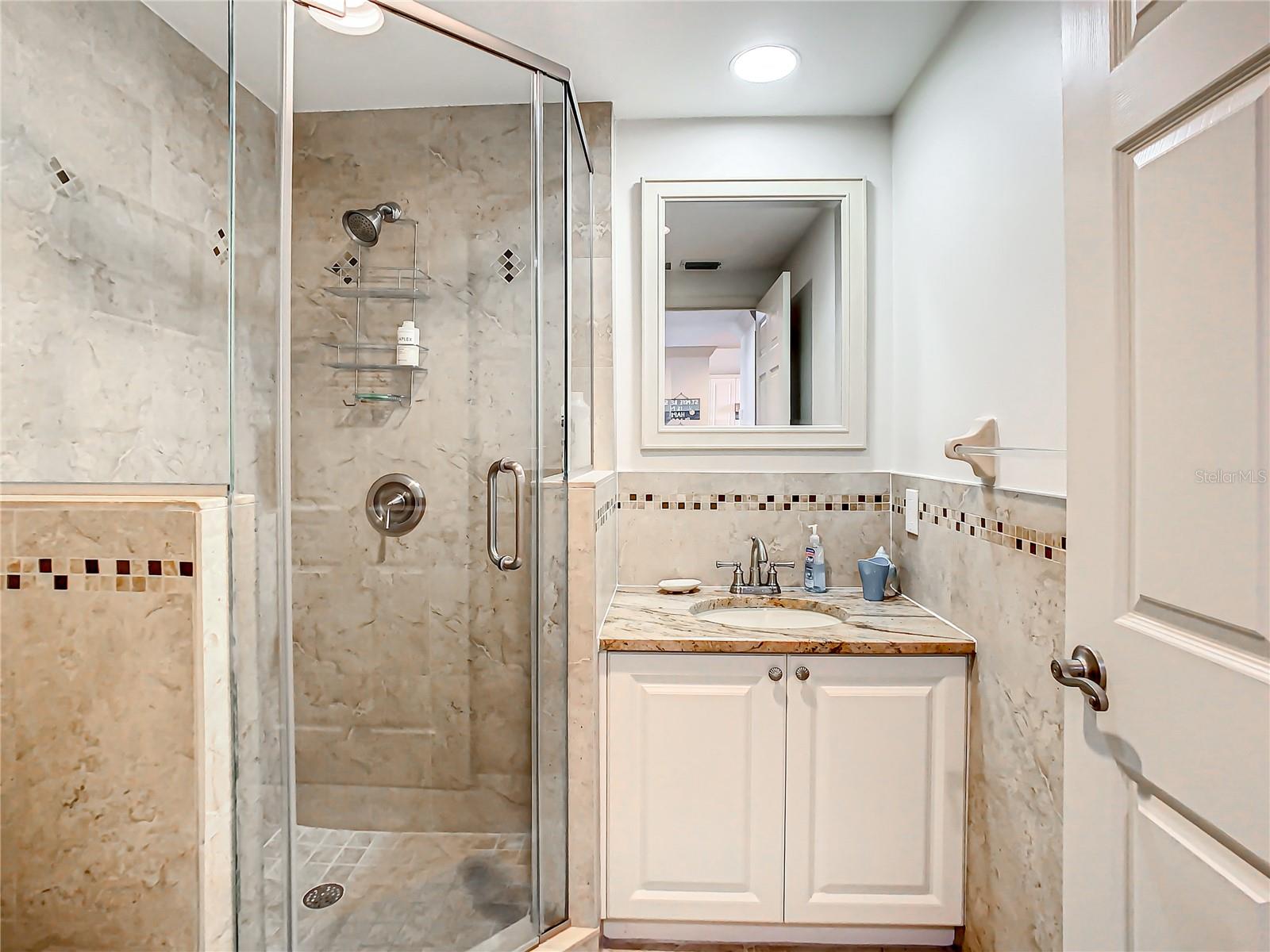 This is the guest bathroom, nicely updated with walk in shower.