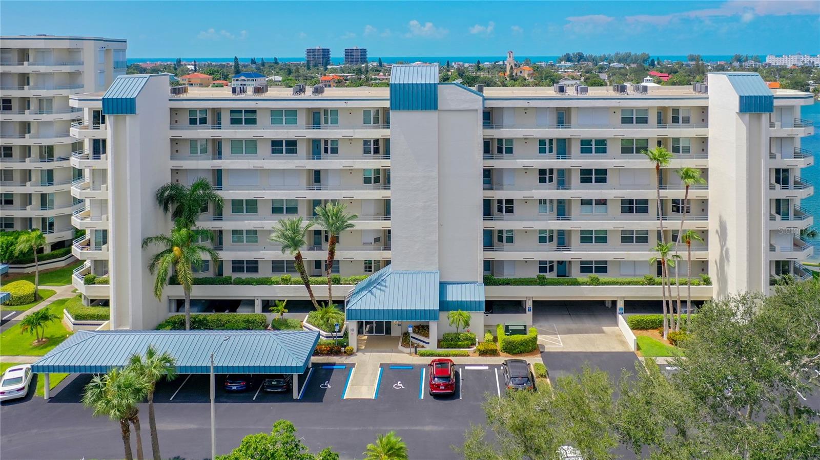 Aerial view of this lovely condo located on the 5th floor of the building with under the building covered parking.