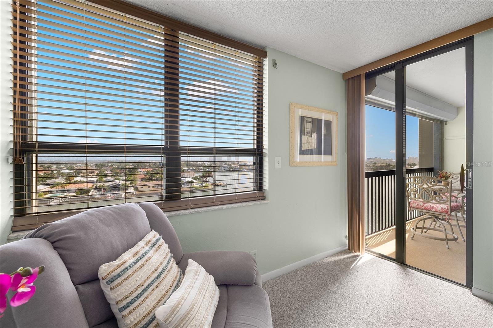 Wonderful natural light comes into the primary bedroom with a door to the balcony