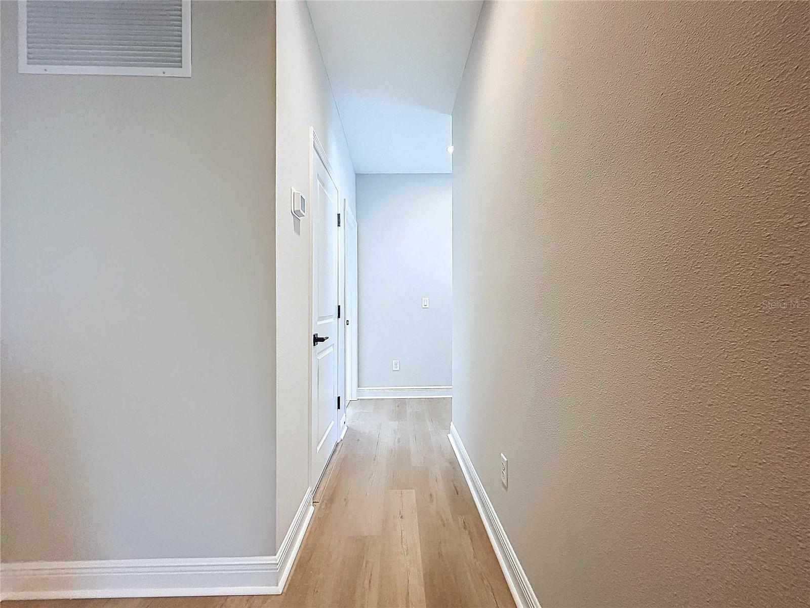 hallway to guest beds and bath