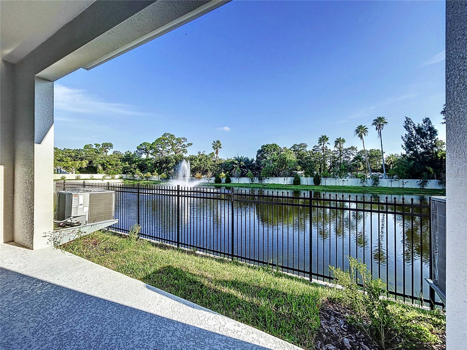 covered lanai with pond view