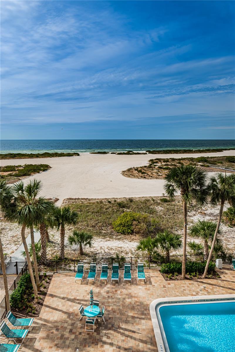 View of the pool, walkway to the beach and Gulf
