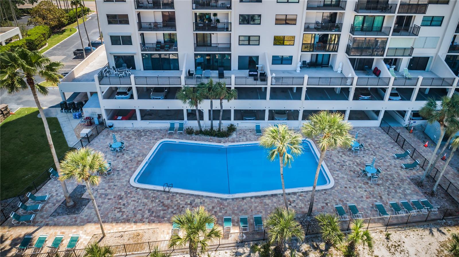 Aerial view of pool and rear of condo