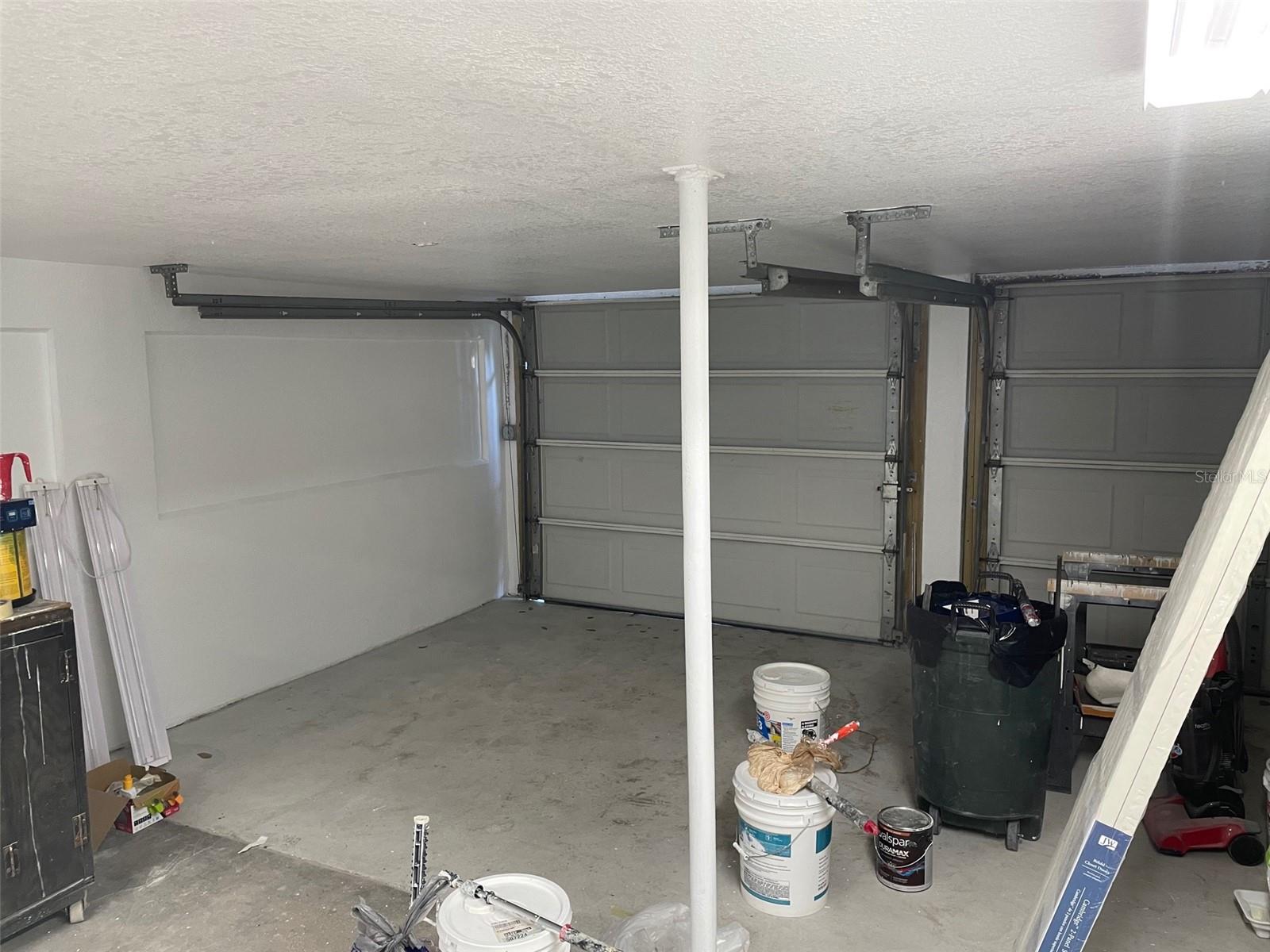 Garage with 1 full parking space and 1 half space (on right) which would fit a Smart Car or golf cart.