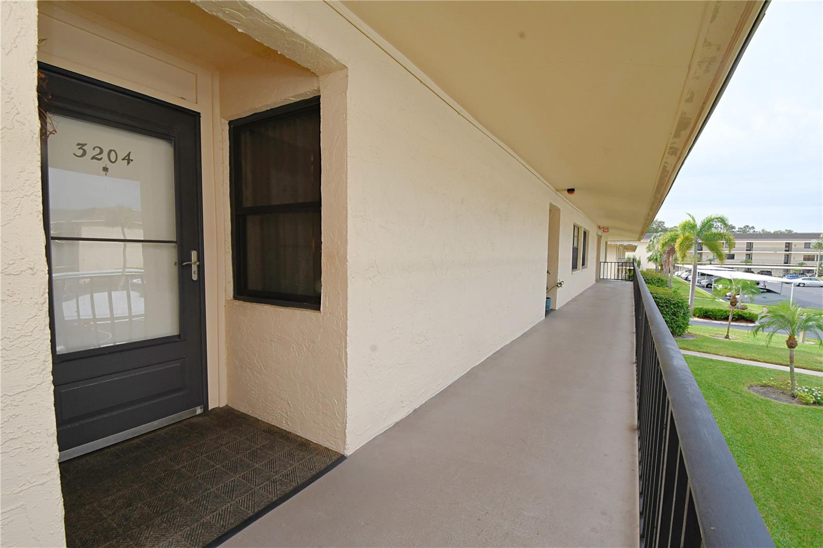 The entrance to the unit is featuring covered front porch.
