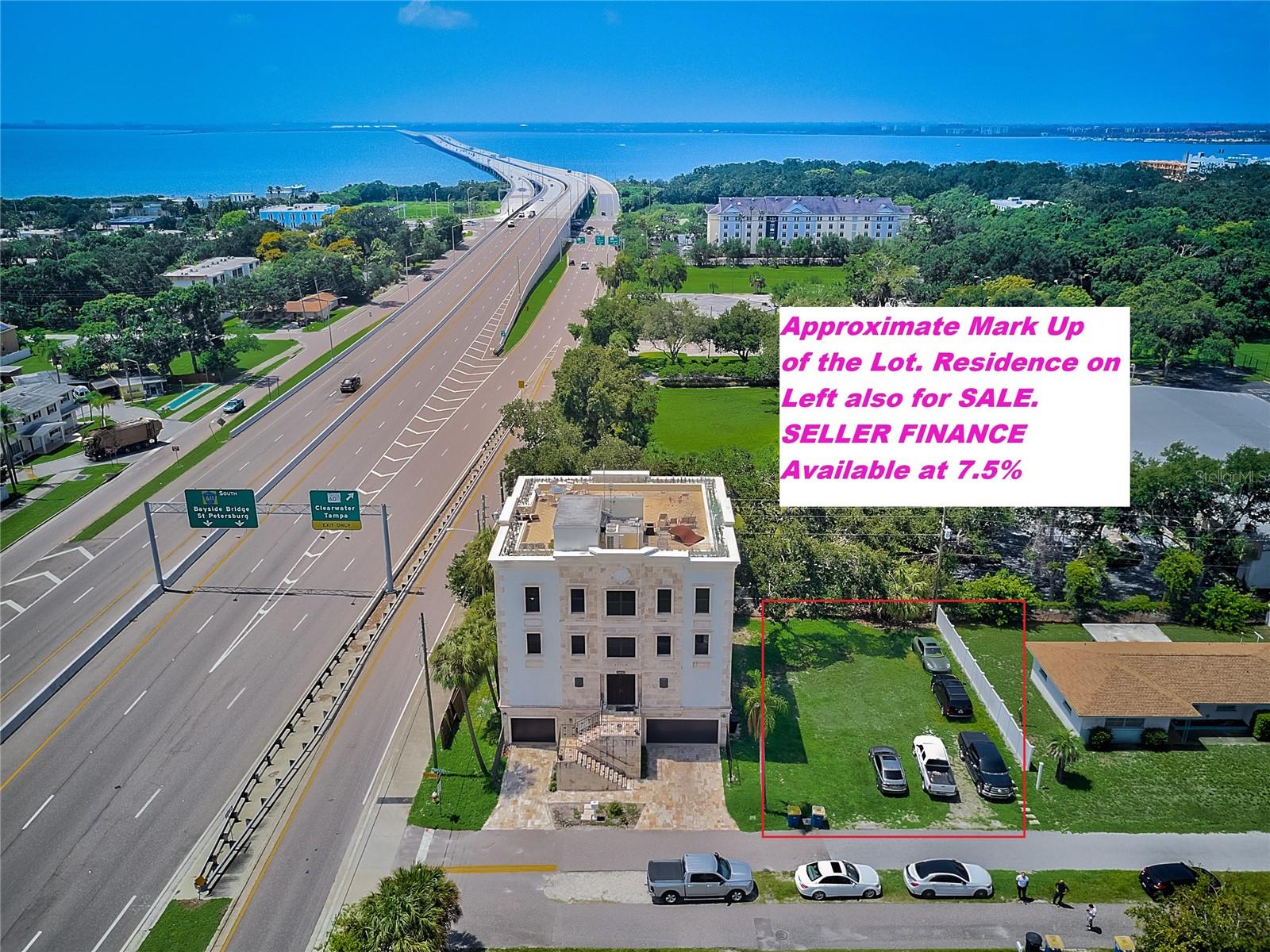 This listing includes BOTH parcels including the marked lot on the right and lot on the left with the Race Car Mansion