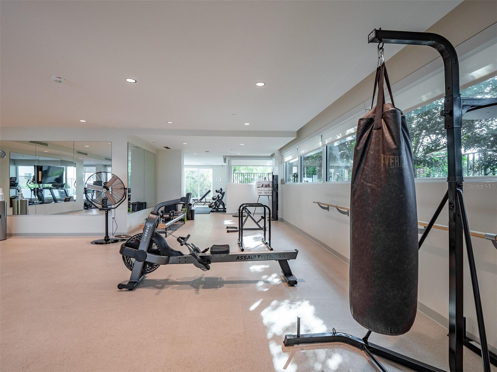 Fitness center with top of the line equipment and marina views
