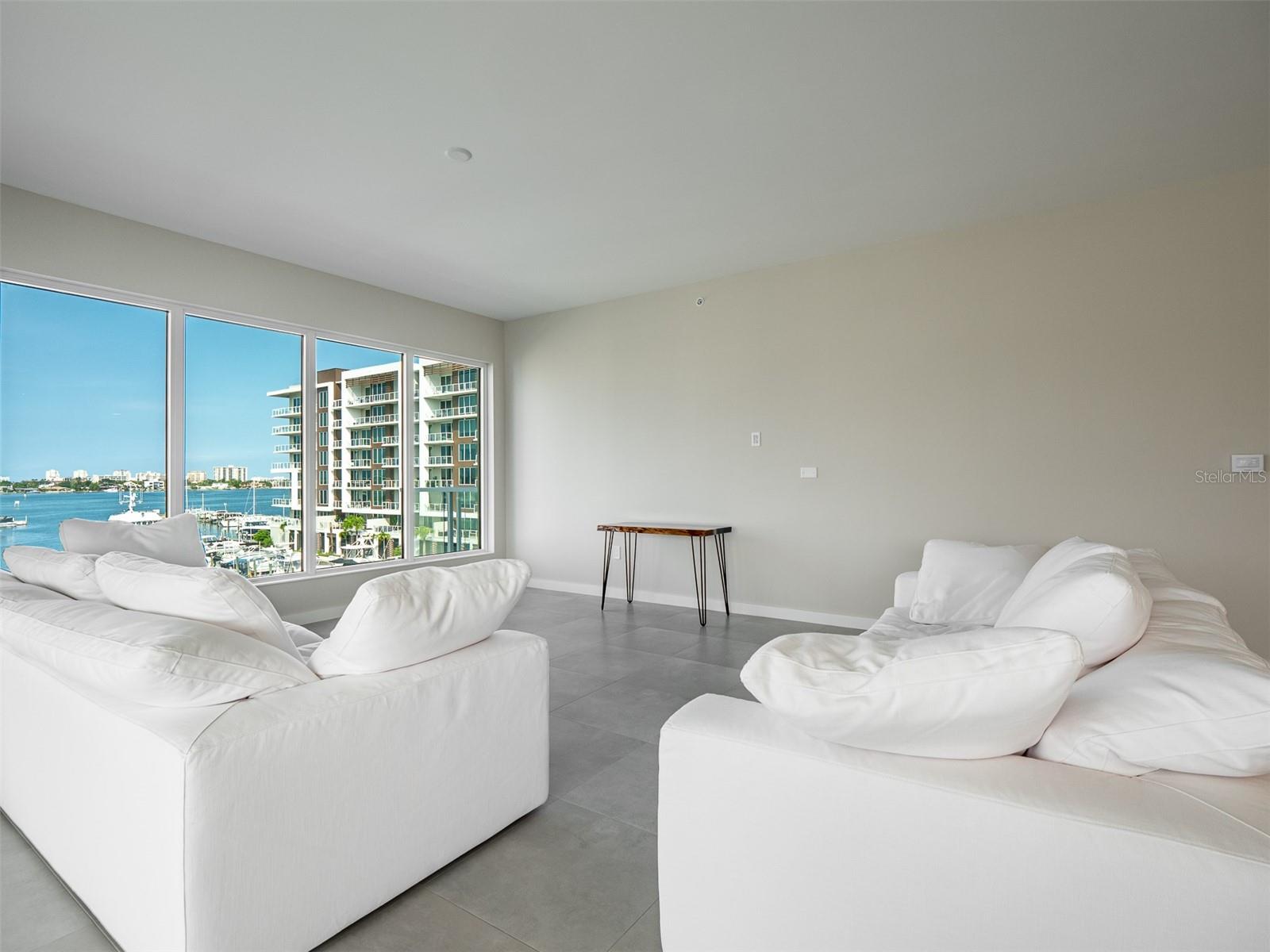 Luxury awaits in the living room overlooking the marina and intracoastal waterway