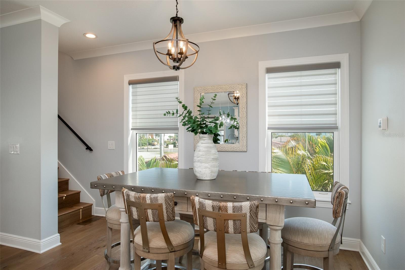 The dining area provides the perfect setting to converse and connect, surrounded by the tranquil ambiance of coastal living, fostering memorable moments and heartfelt conversations.