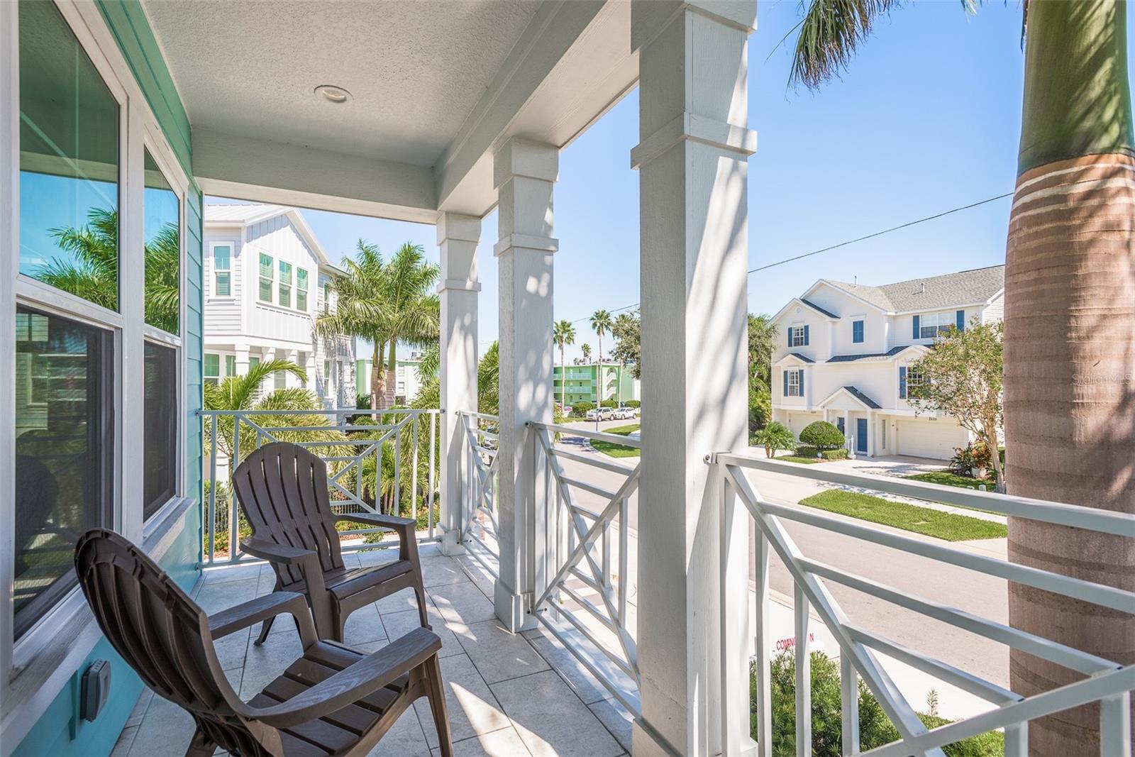 Step onto the rear porch of this coastal haven, where gentle sea breezes mingle with the sounds of the ocean, providing a tranquil outdoor retreat to unwind and enjoy the serenity of coastal living.