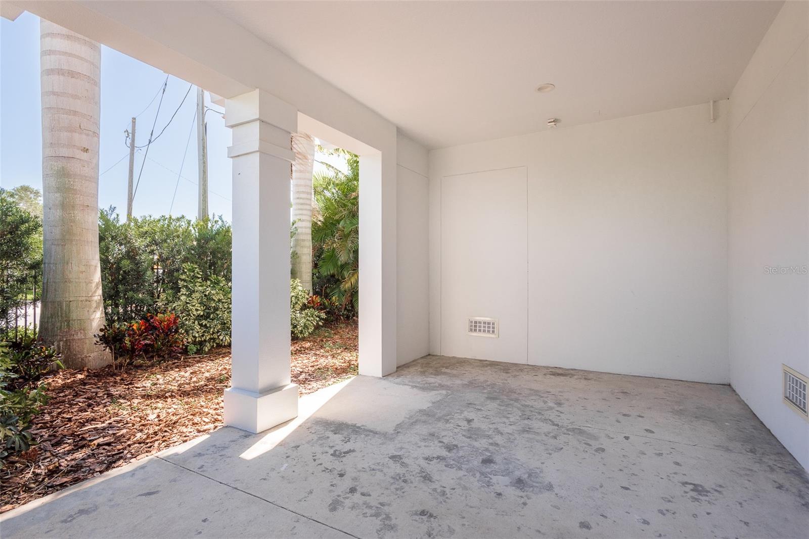 The first-level fenced patio off the garage offers a private outdoor oasis, perfect for al fresco dining or simply basking in the coastal breeze, providing a charming extension of your coastal lifestyle.