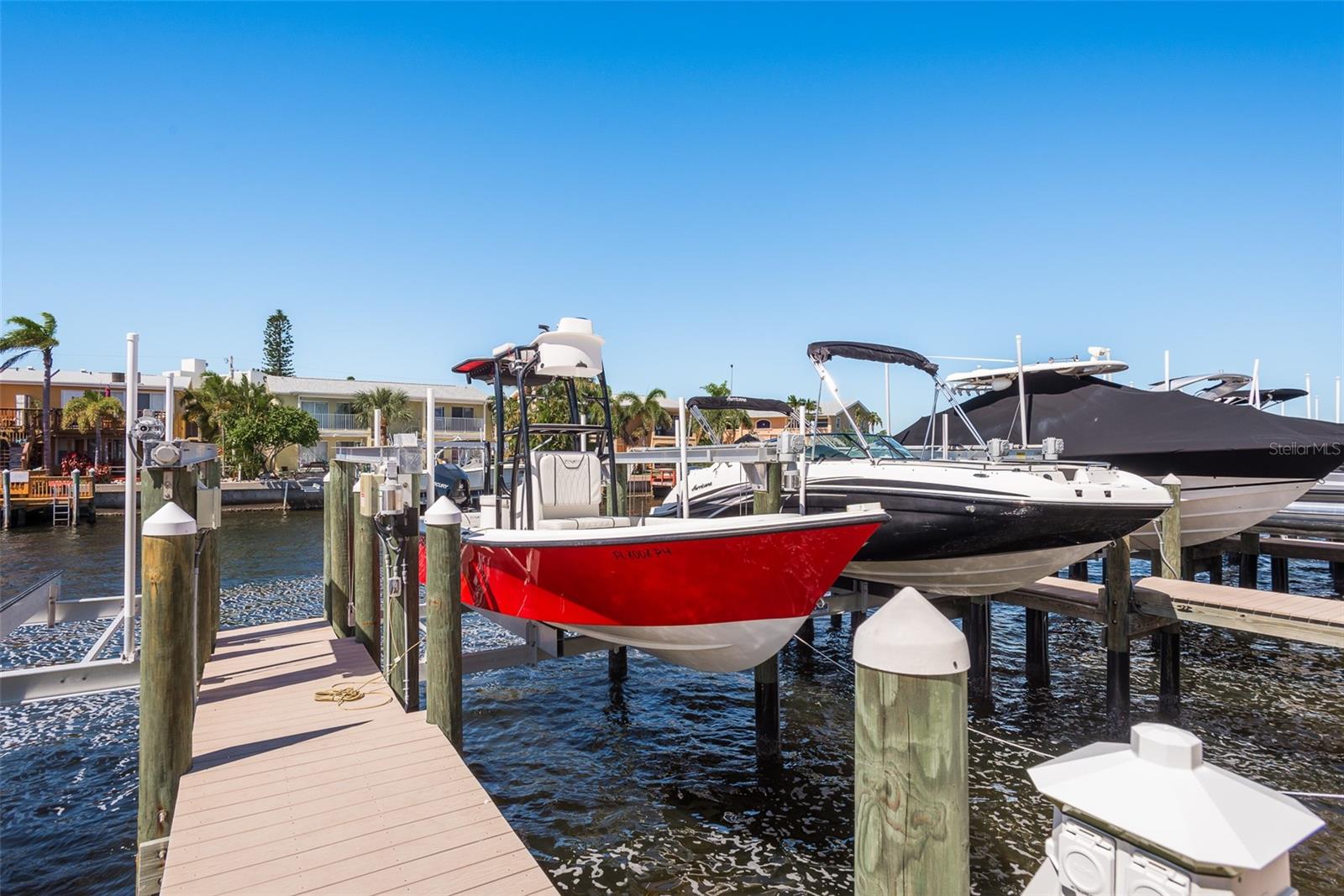 Dock your boat with ease at your private boat dock equipped with a 10,000-pound hydraulic lift, offering both convenience and peace of mind as you embark on unforgettable maritime journeys from your coastal sanctuary.
