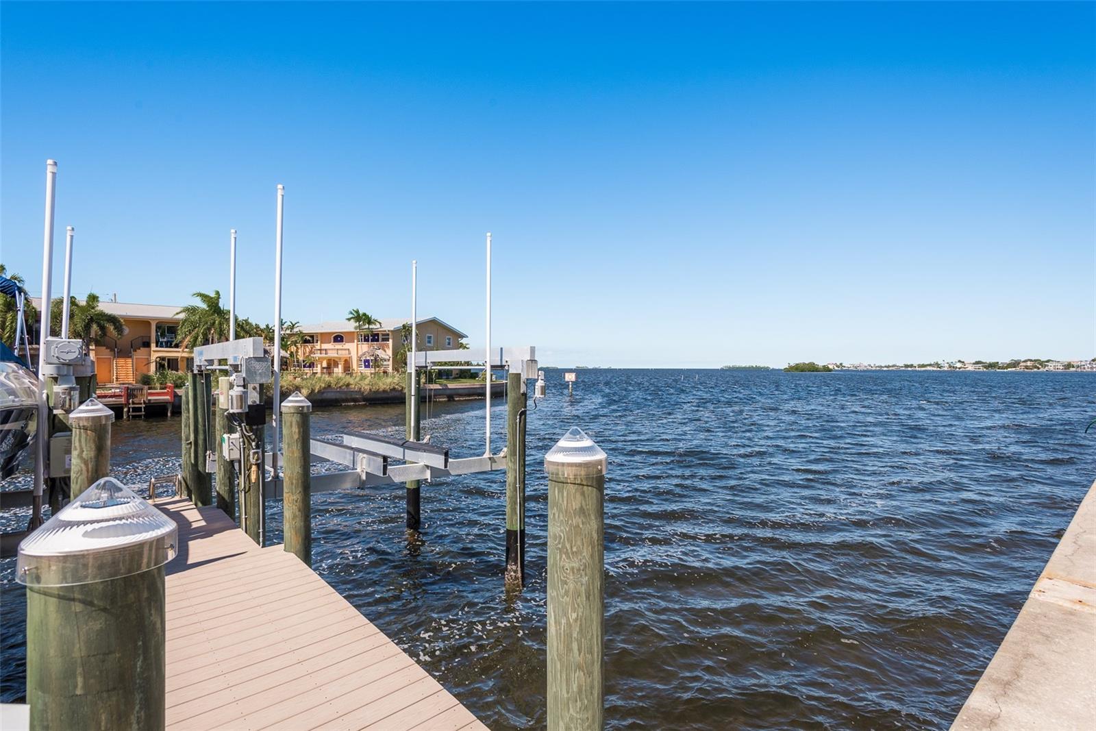 Enjoy direct deep water access from your private dock, opening up a world of maritime exploration and aquatic adventures right from the comfort of your coastal haven.