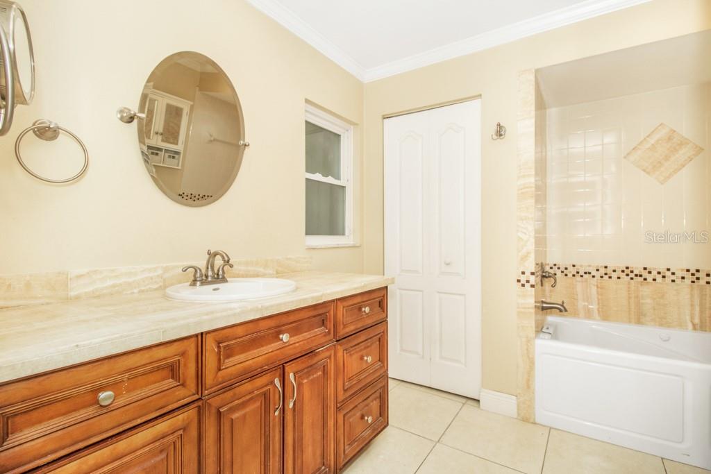 Master bathroom featuring a step-in shower, and rejuvenating jacuzzi tub.