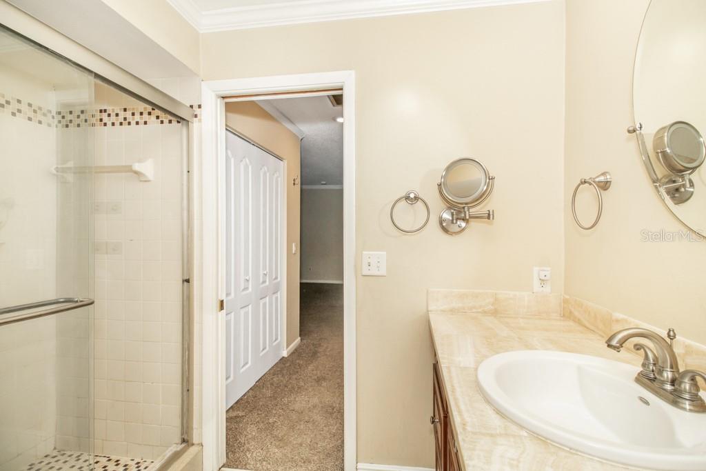 Master bathroom featuring a step-in shower, and rejuvenating jacuzzi tub.