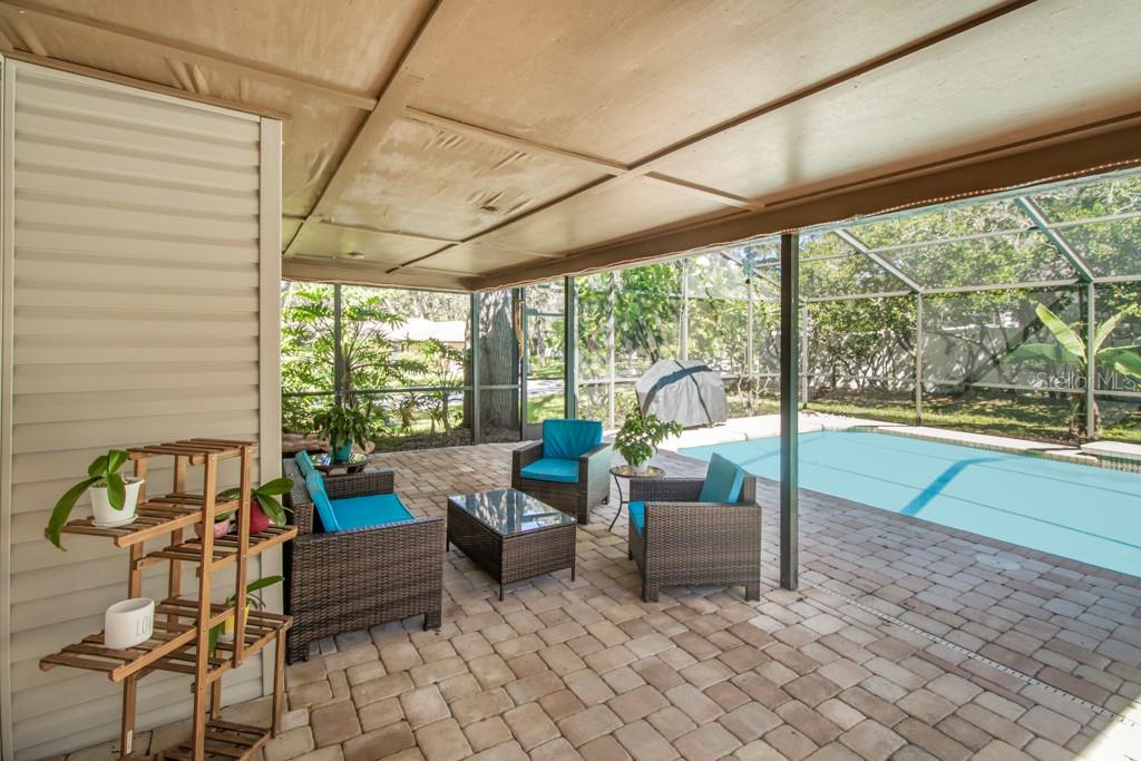 Large screened pool with sitting area