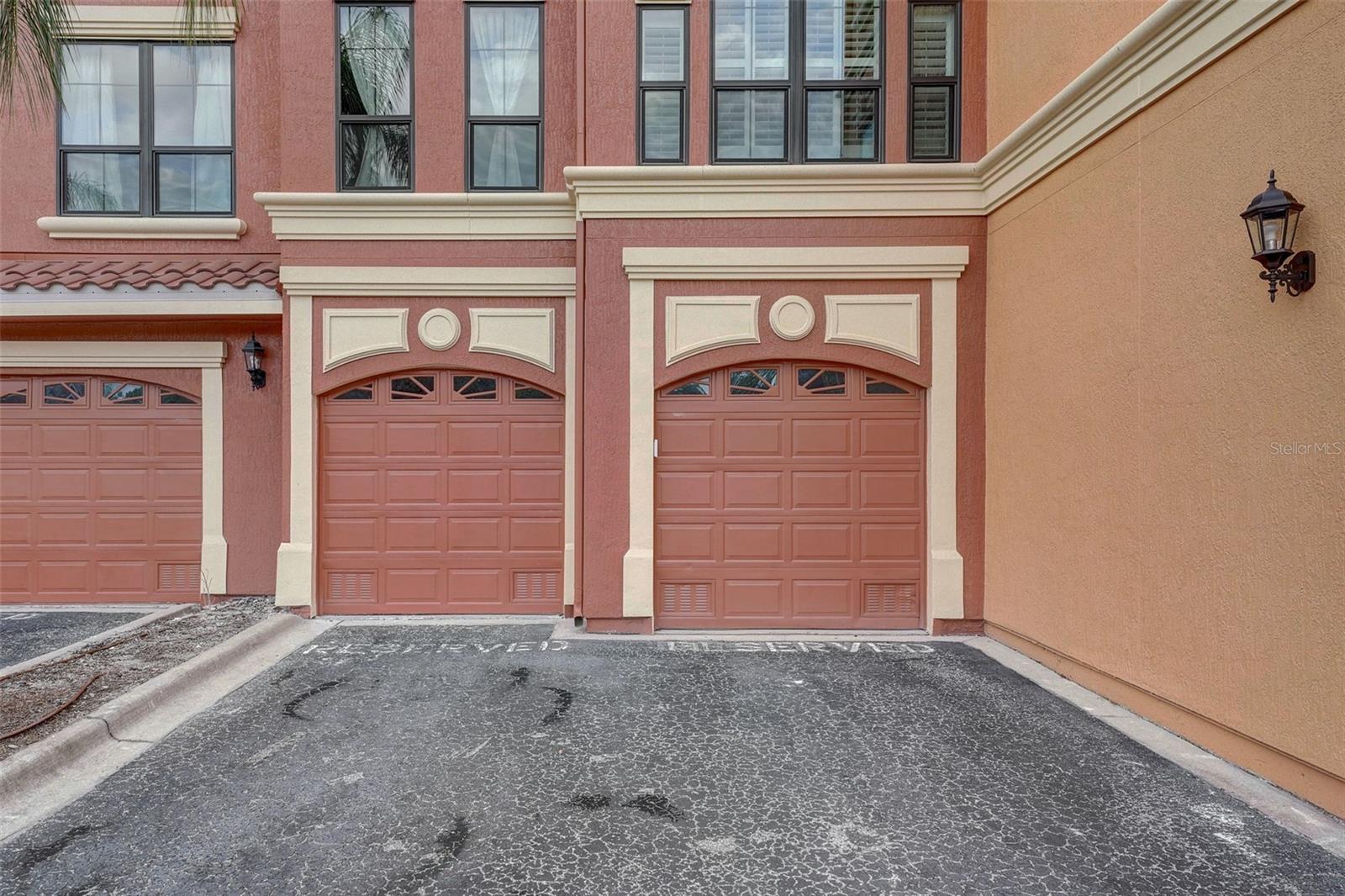 Two car garage and two parking spaces in front of garage
