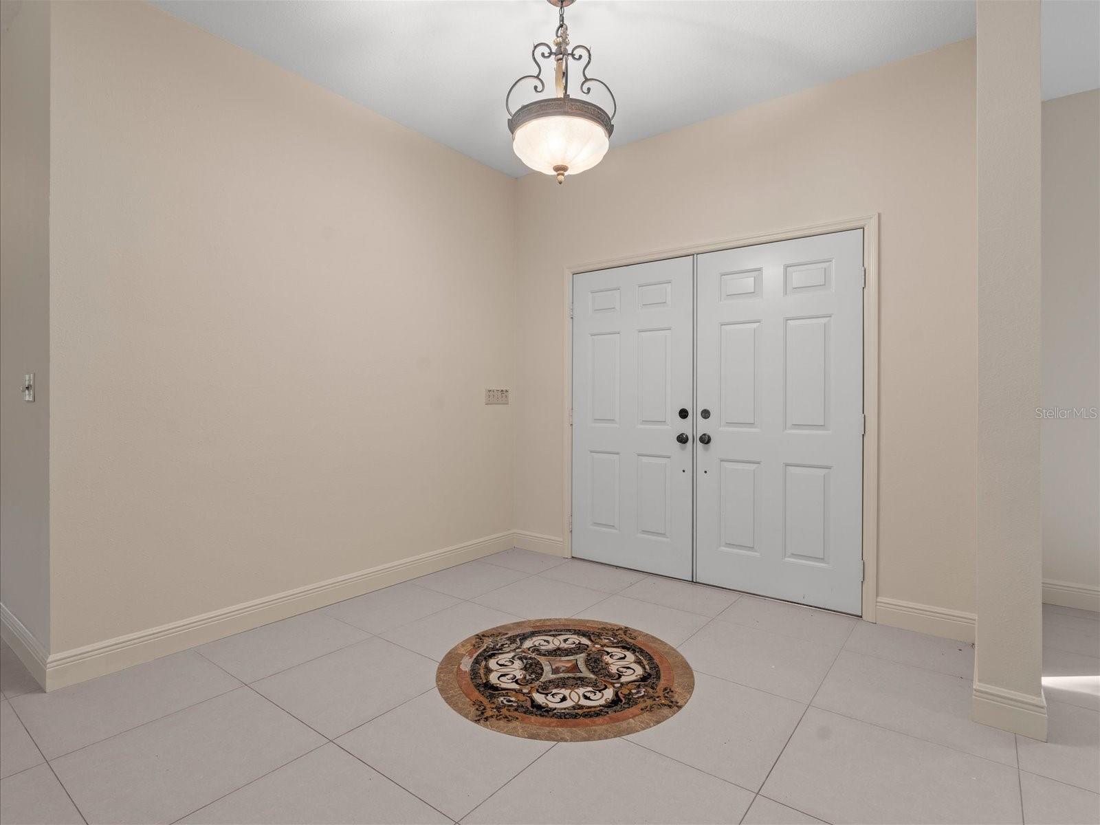 Welcome to your Main House with custom tile medallion entryway