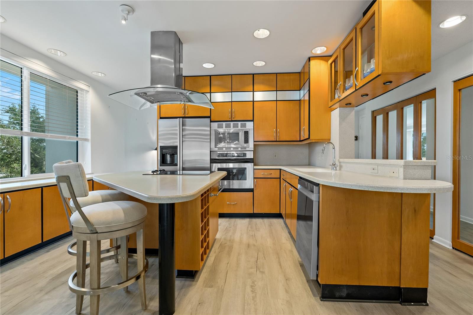 Gorgeous kitchen with stainless appliances with plenty of storage