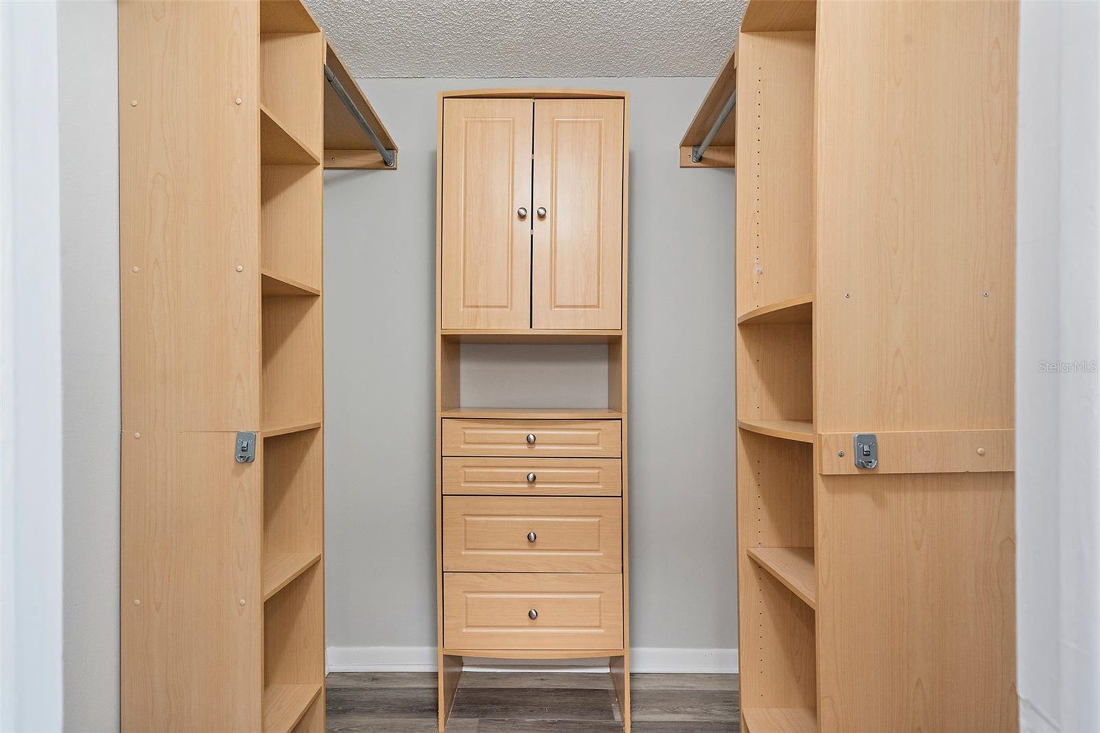 Walk in closet with built in storage system.