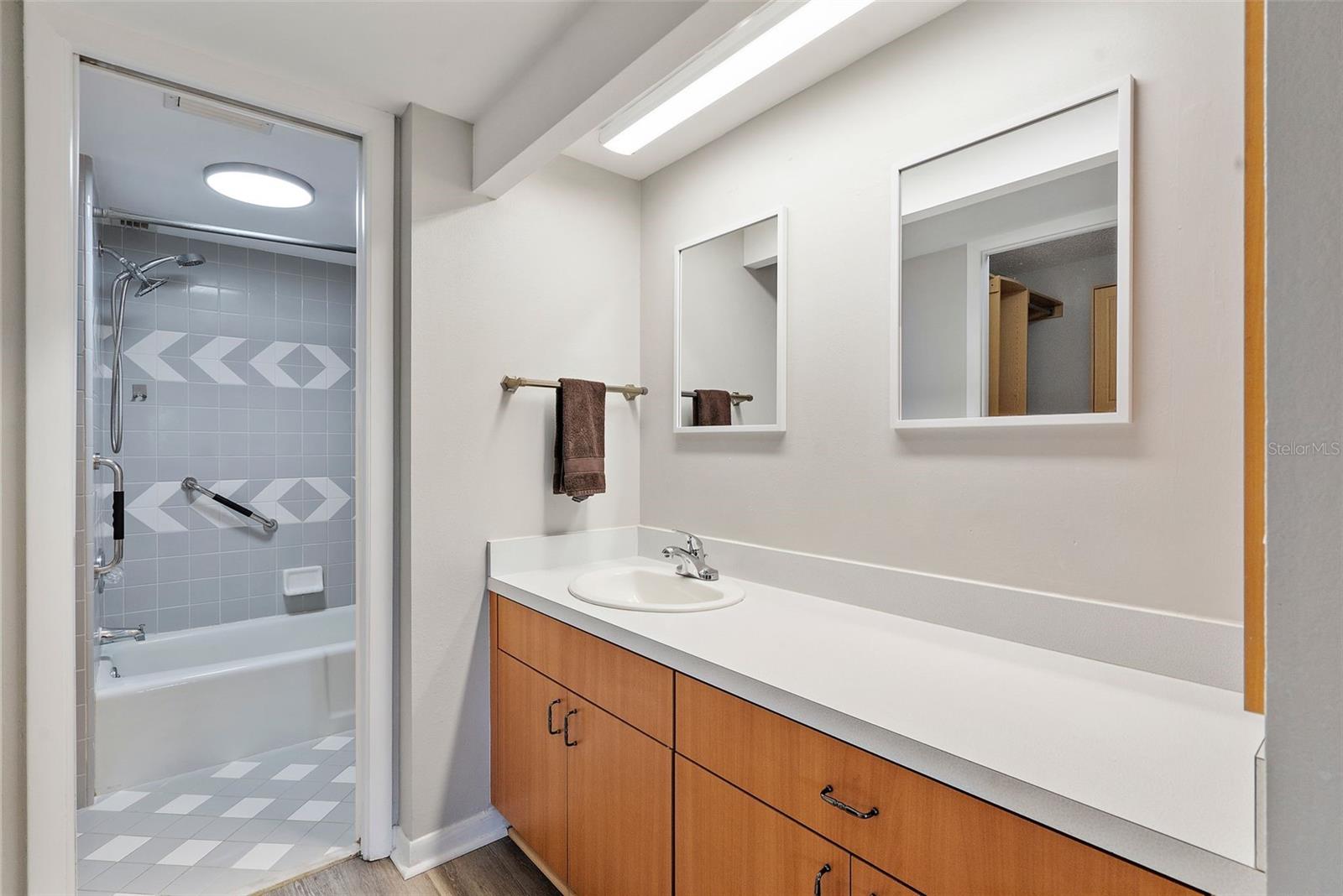 The bedroom boasts a walk-in closet and ensuite bath.