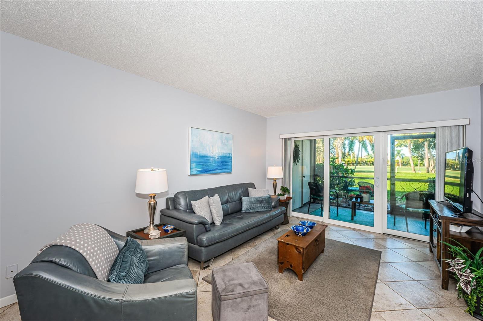 With tile throughout, this condo offers easy maintenance and a seamless flow from room to room, perfect for coastal living.