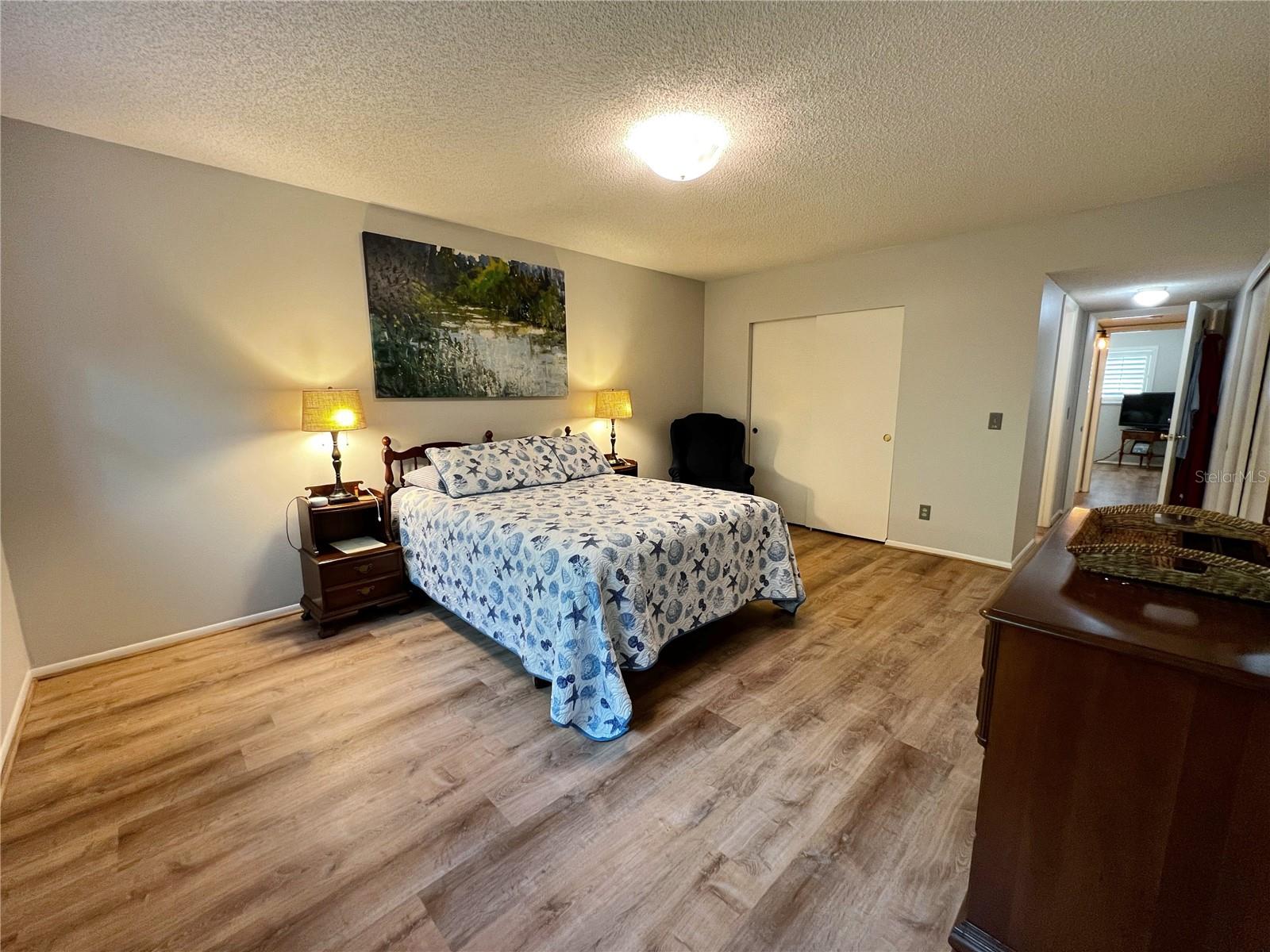 Large master bedroom with two spacious closets.