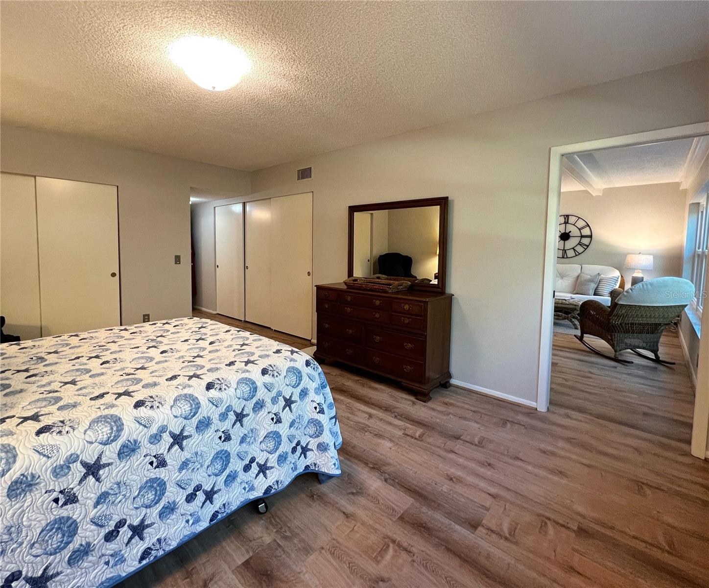 View of the master bedroom, it's two large closets, and the direct access to the family room.