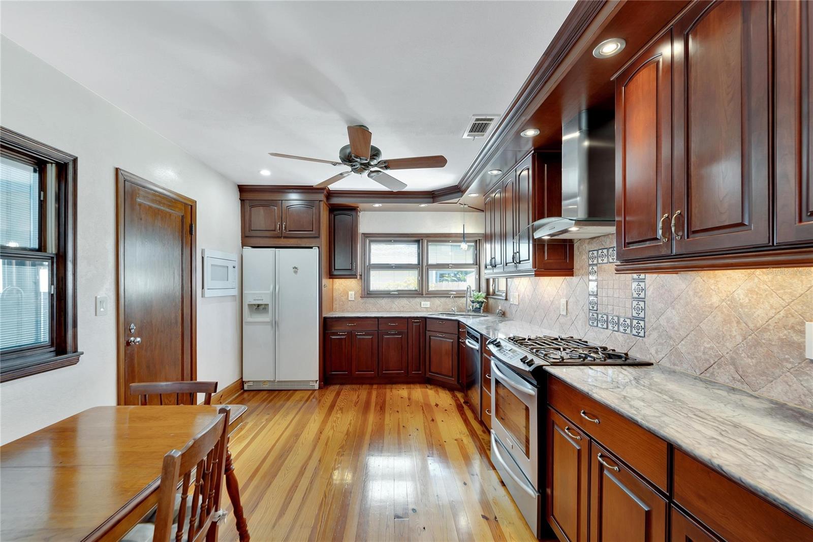 Beautiful custom kitchen with hard wood cabinetry, stone countertops and many special features..