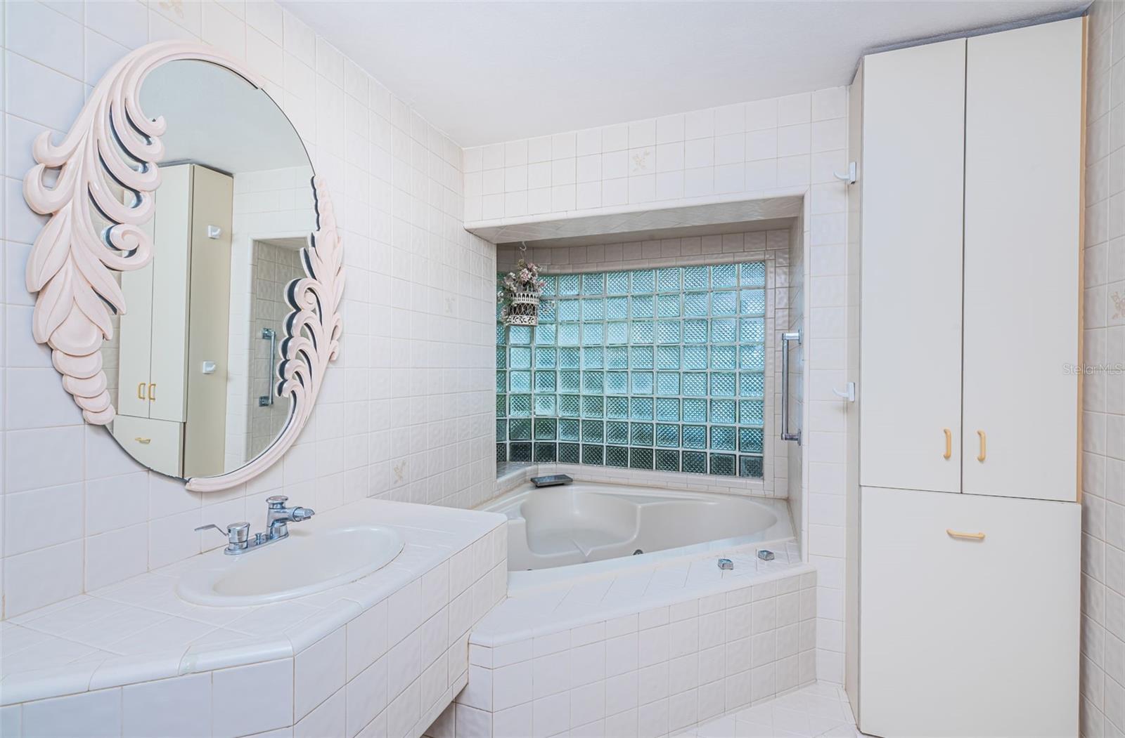 Experience luxury with an elevated jacuzzi in the master bathroom of this property! This elevated feature adds a touch of indulgence to your private retreat, providing a perfect spot to unwind and relax.