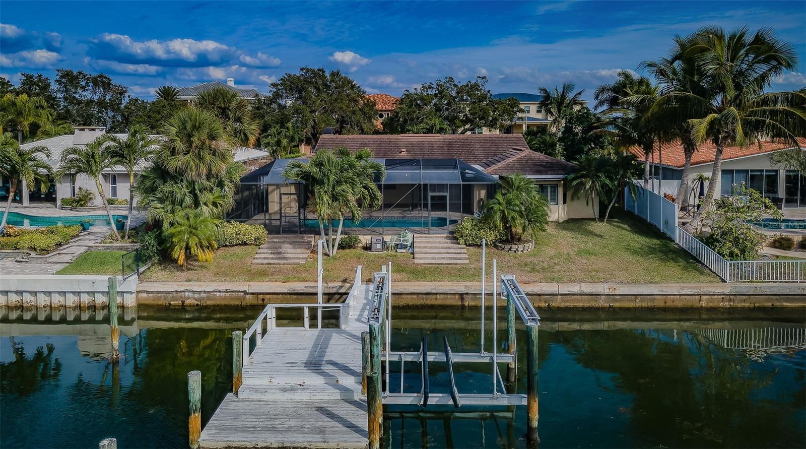 Complemented by a thoughtfully placed boatlift, this property seamlessly combines the joy of a waterview with the practicality of a dock, making it a dream home for those seeking a waterside haven.