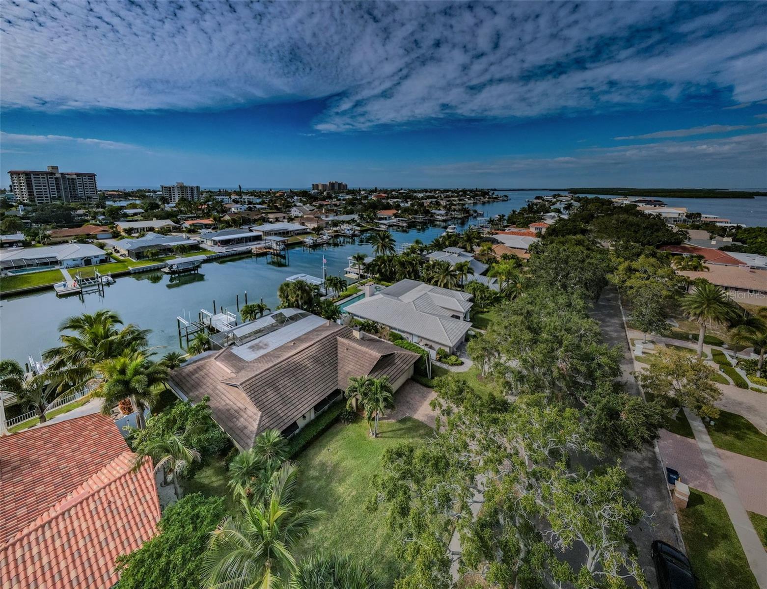 This aerial perspective provides a unique glimpse of the property's position in the neighborhood, offering a bird's-eye view of its beauty and potential.