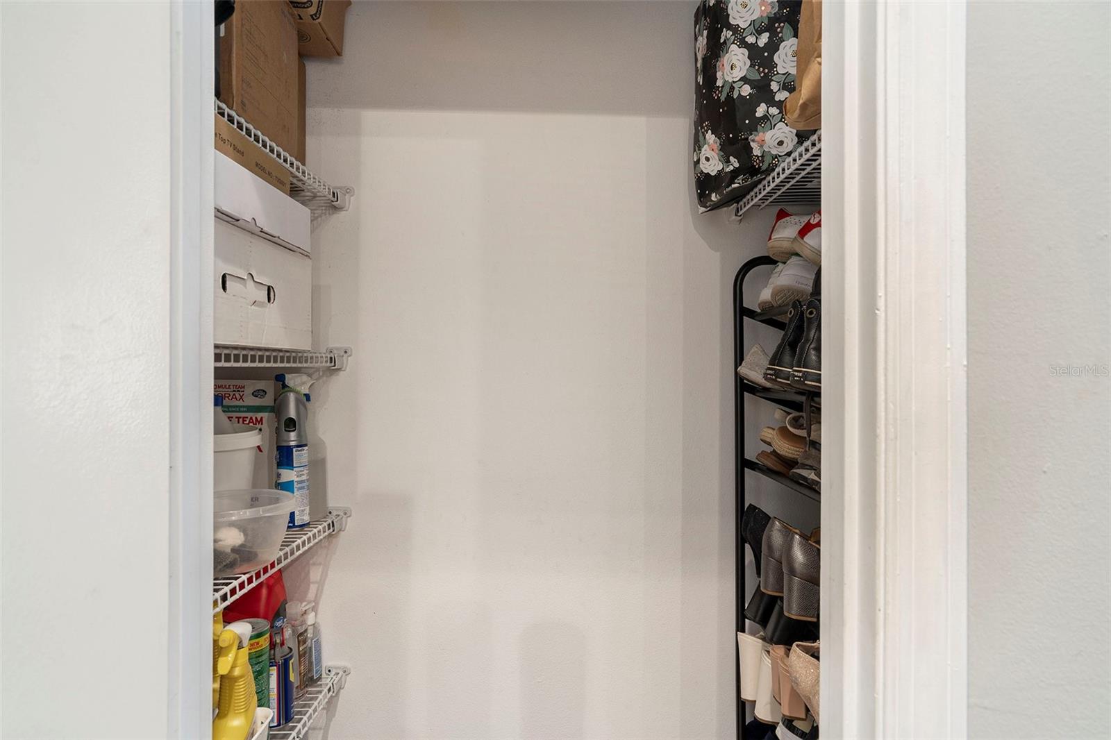 A shoe closet/storage room near the front door
