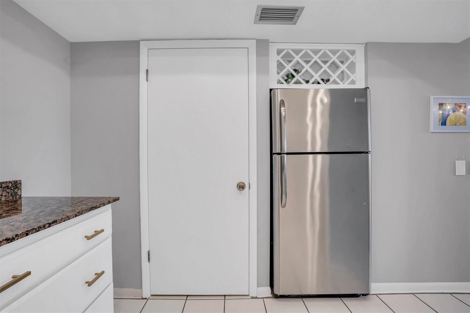 Kitchen has Pantry and Wine Storage Above Refrigerator