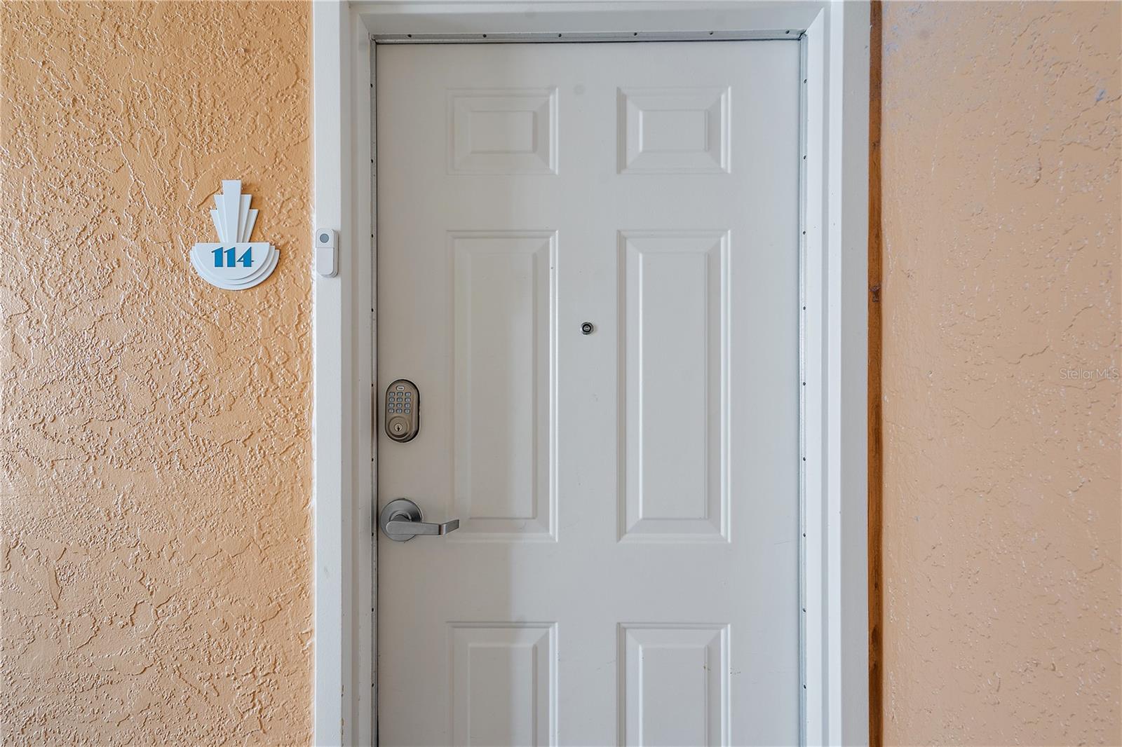 Entrance with coded door lock.  Each guest is assigned a fresh code, and they love it—no lost keys.  The inevitable run back and forth from the beach towel is so much less of a nuisance!
