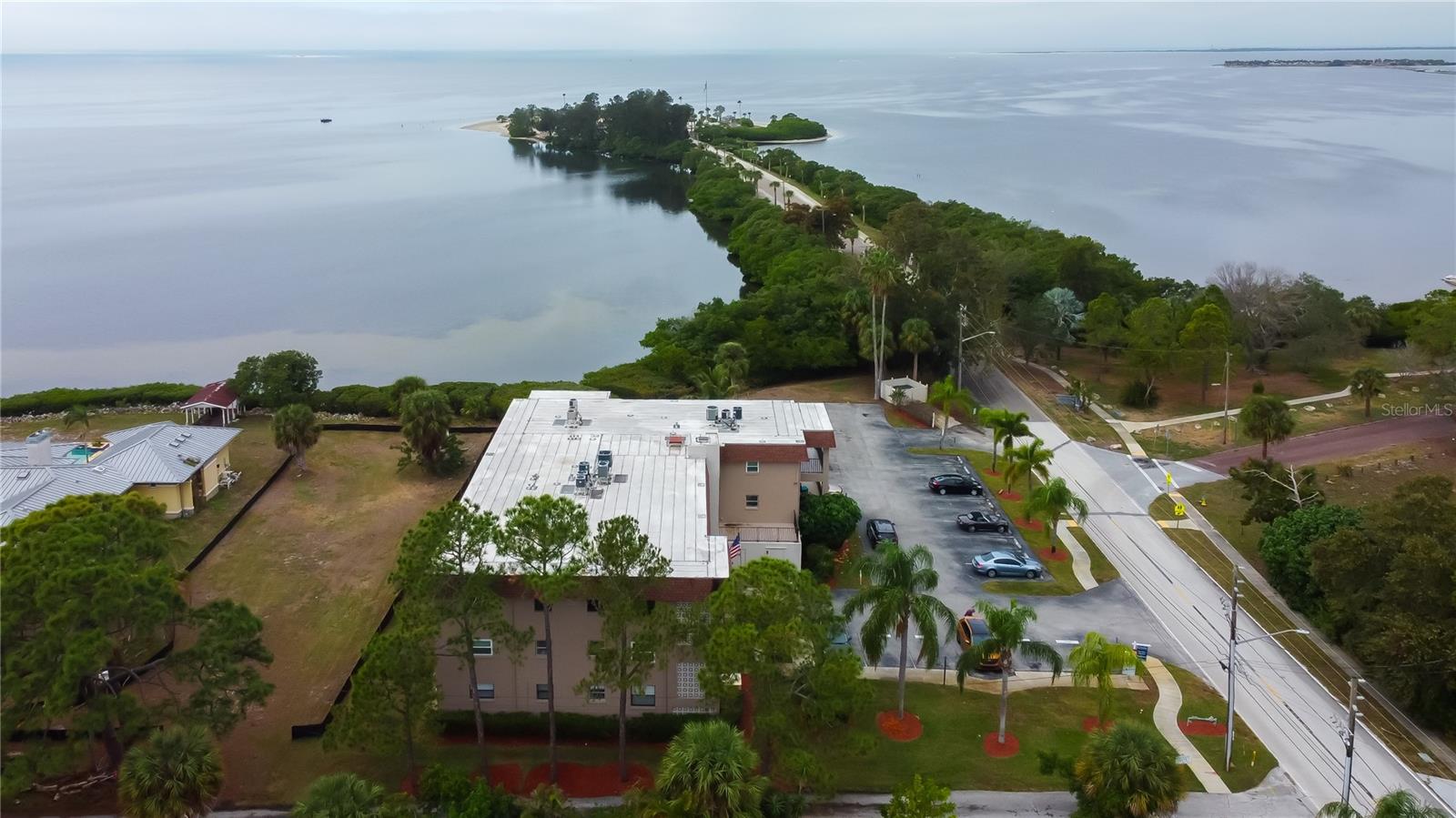 Aerial View of Building Overlooking Sunset Beach