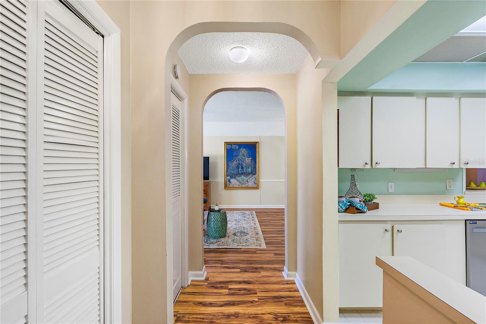Foyer with storage closet and pantry