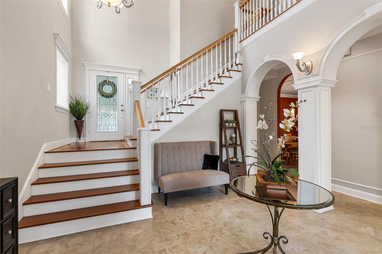 Beautiful entry, custom wood arches, and crown molding.