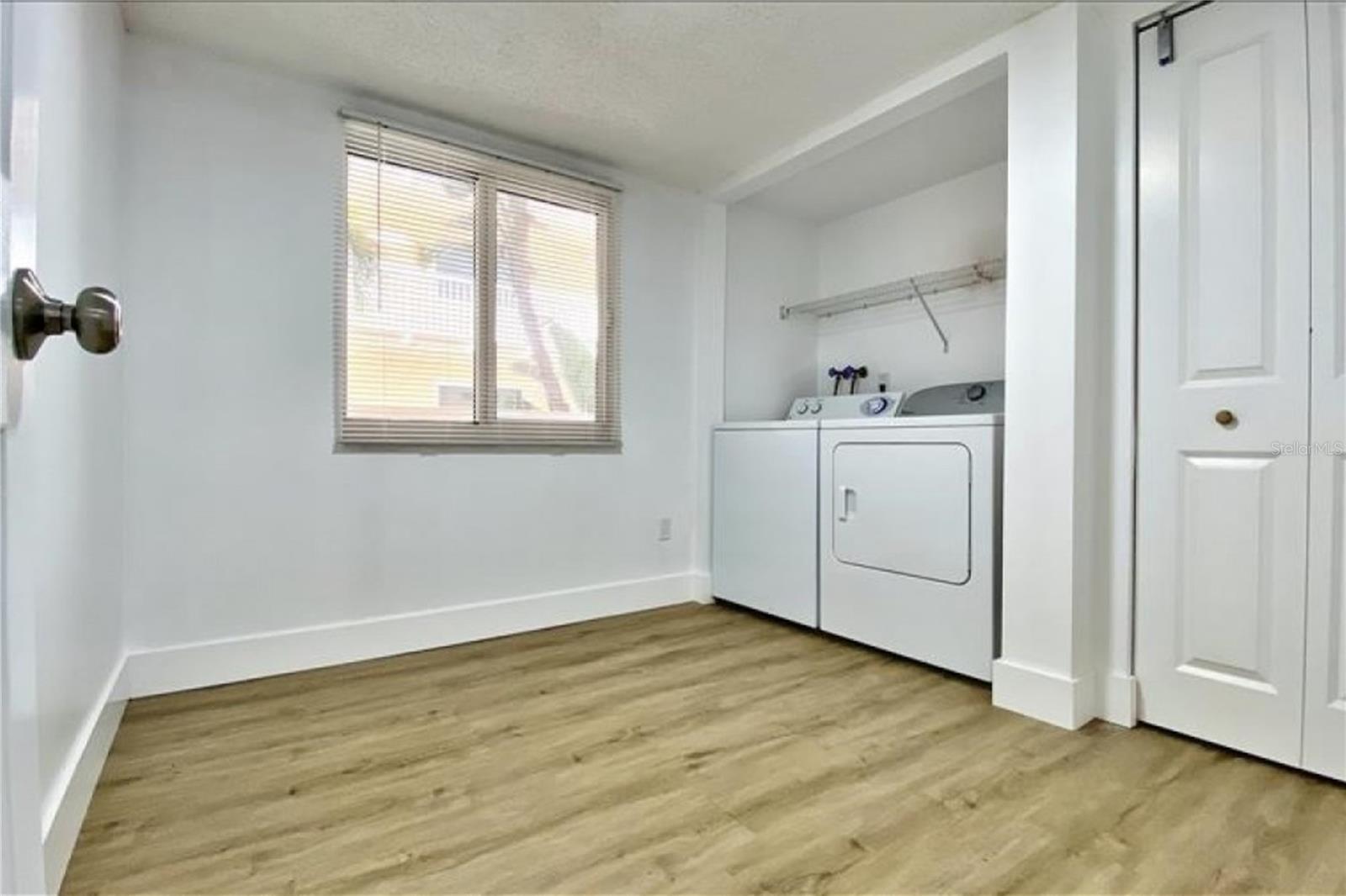 Large storage/laundry room is inside the condo just off the kitchen