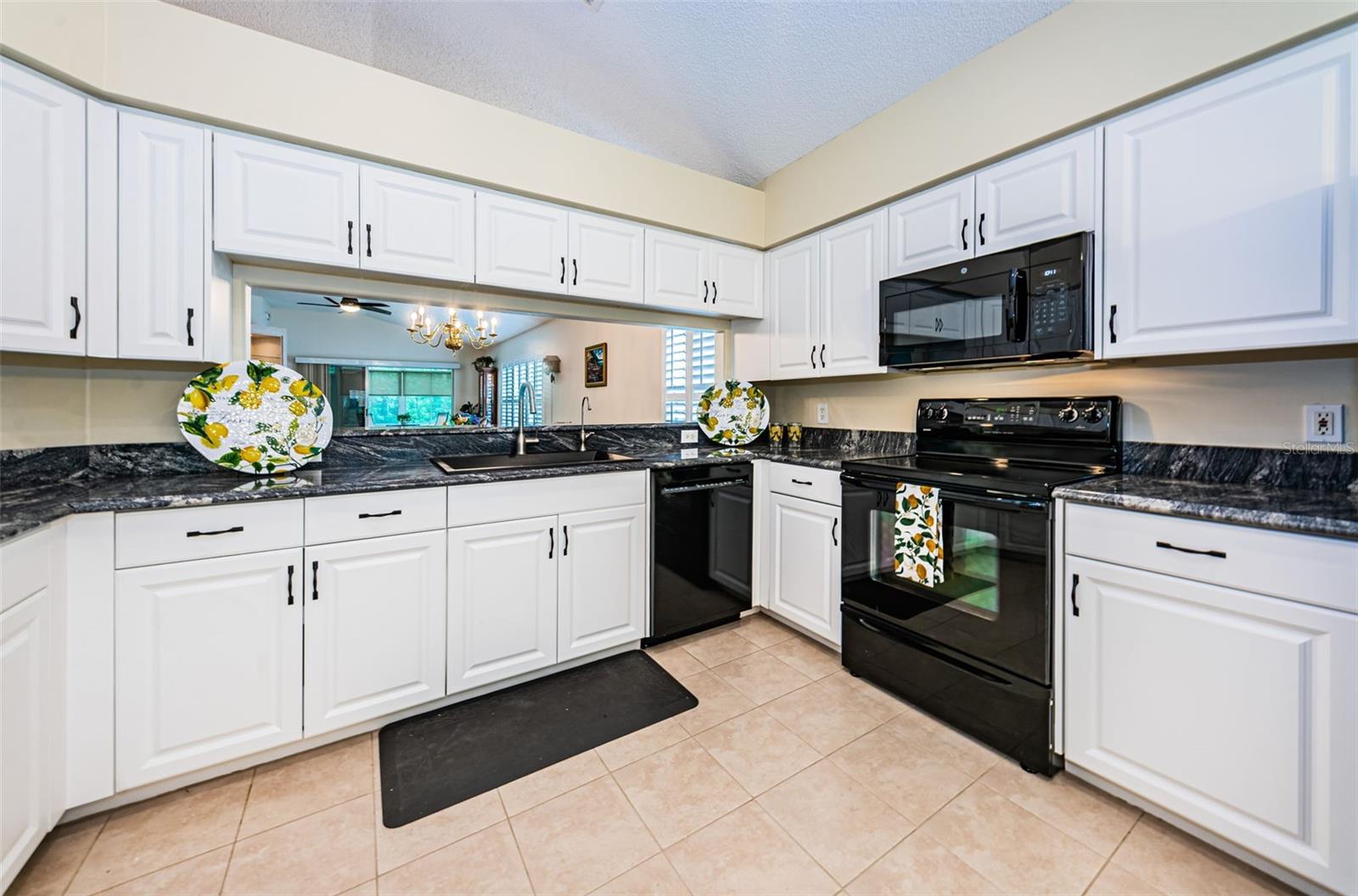 Tile Floors, Cabinets with pull out Drawers & Granite Counters