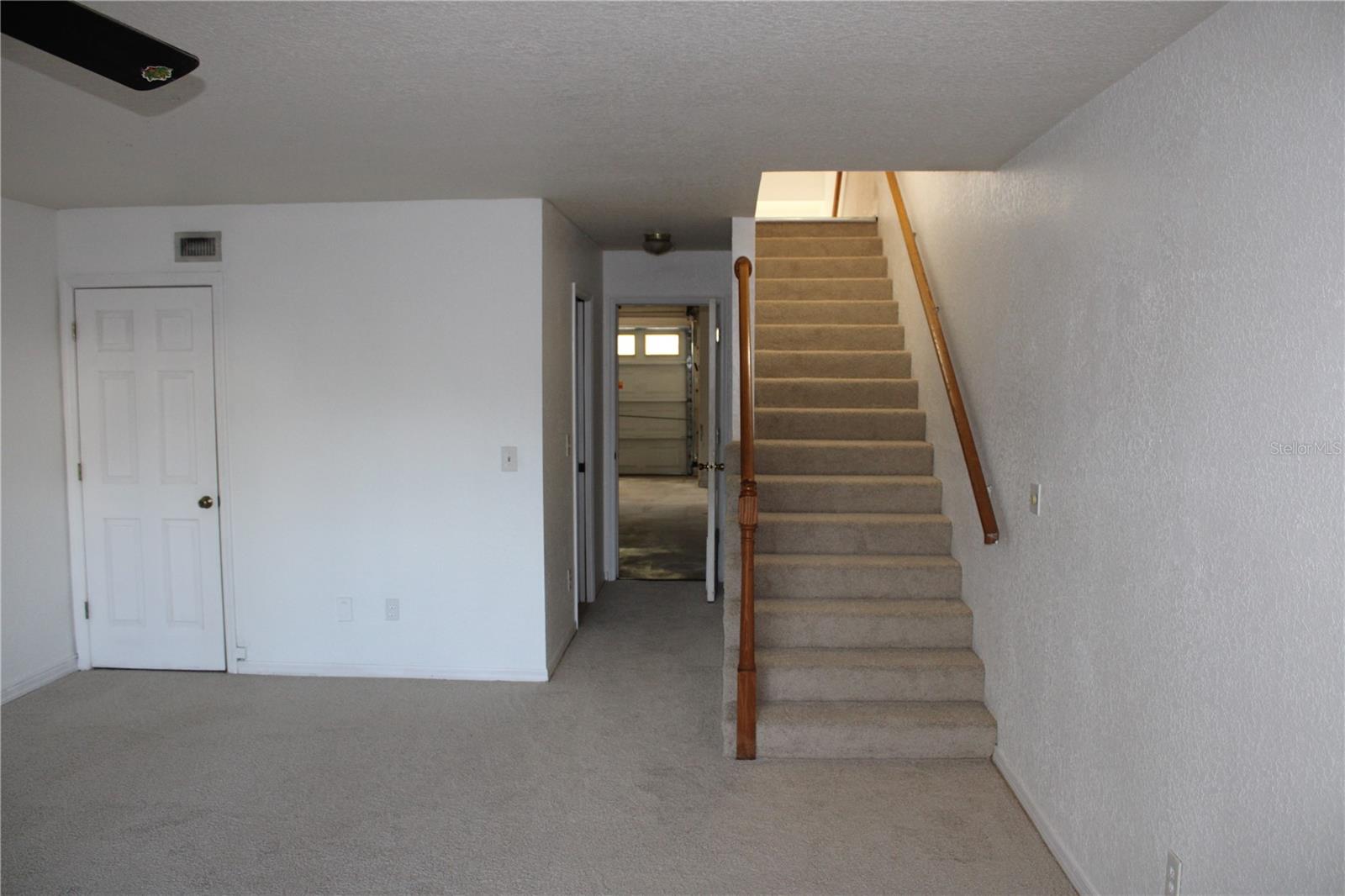Lower floor bonus room and stairway up to main floor