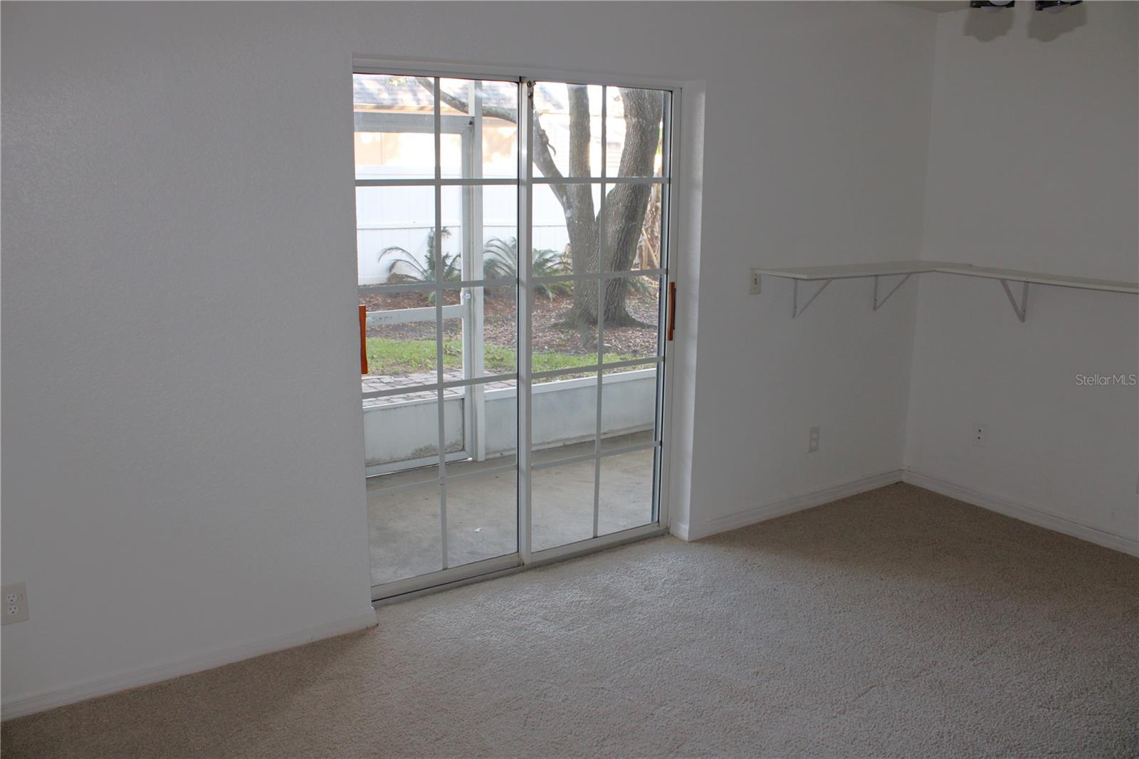 Lower floor bonus room with sliding glass door to lower patio