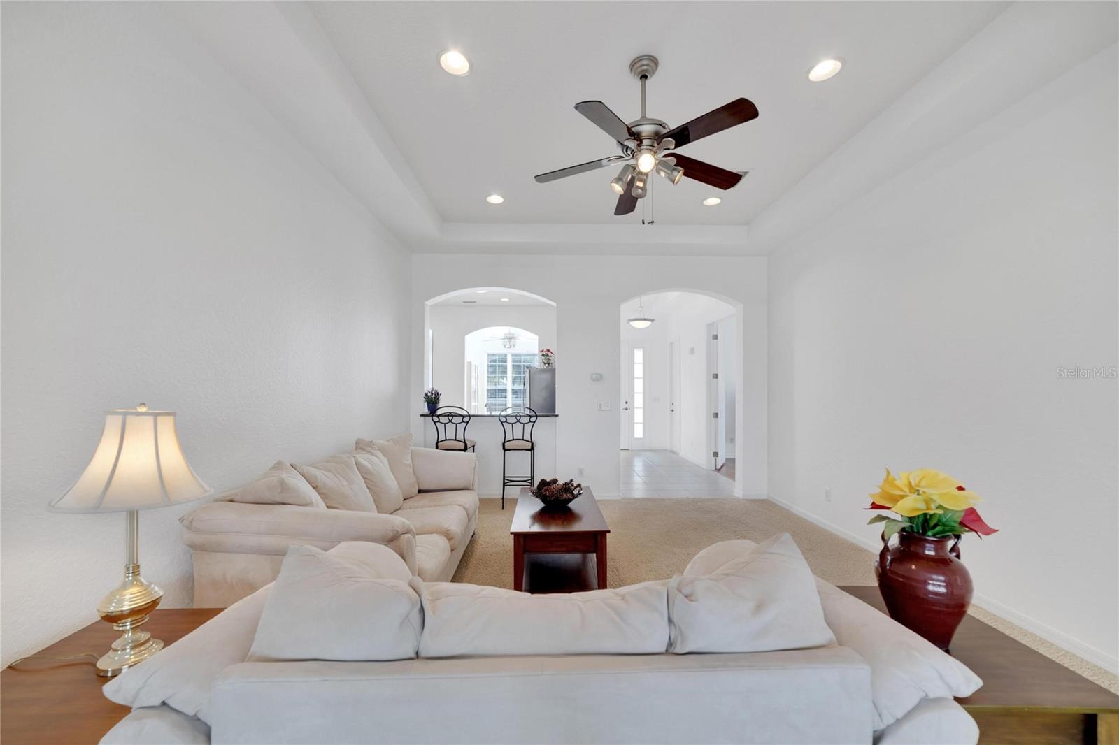 High tray ceilings, and arched entryways give this open and roomy home the feel of a much larger condo