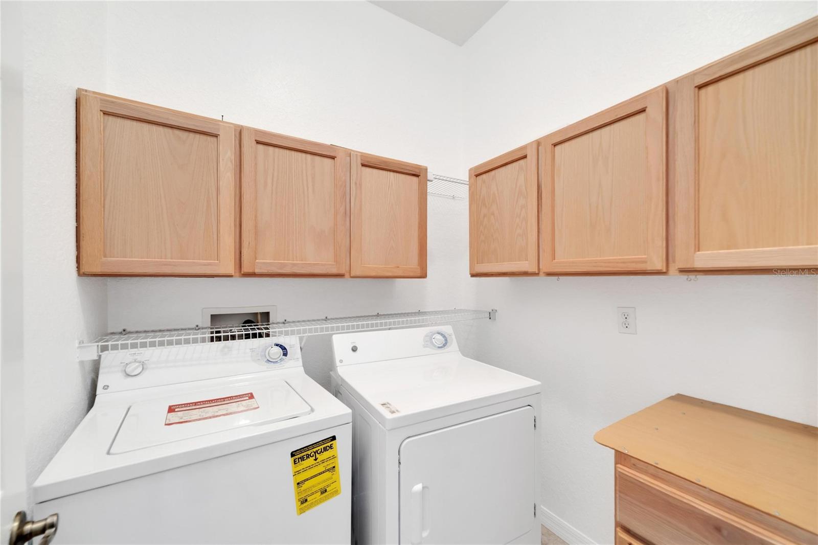 A large laundry room with extra cabinetry is a nice bonus