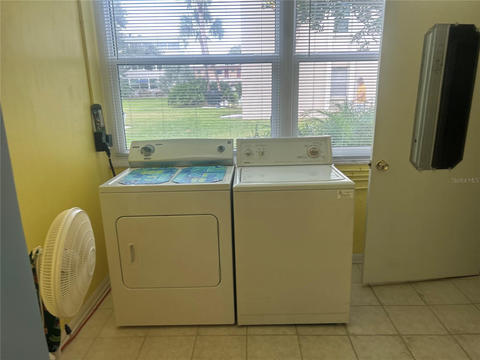 Inside full laundry, door leads to primary bath\.