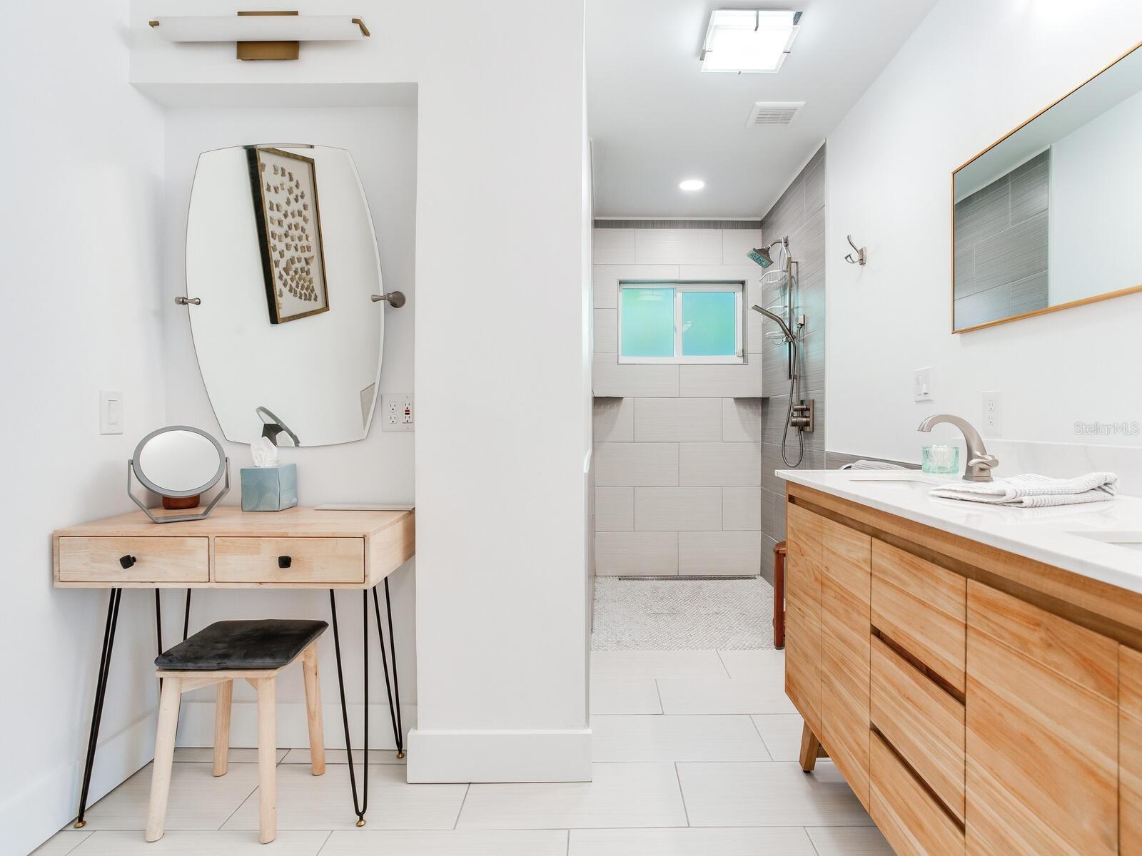 Primary bathroom - Recently built/reconfigured and updated with no-curb shower, double sink vanity, and lighted make-up area.