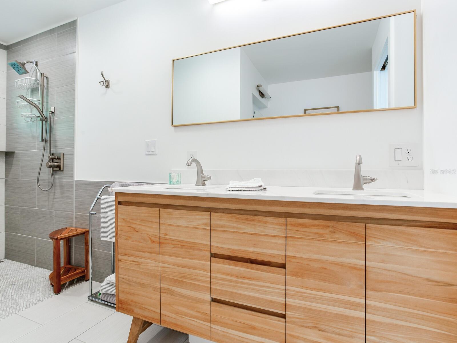 Primary bathroom - Recently built/reconfigured and updated with no-curb shower, double sink vanity, and lighted make-up area.