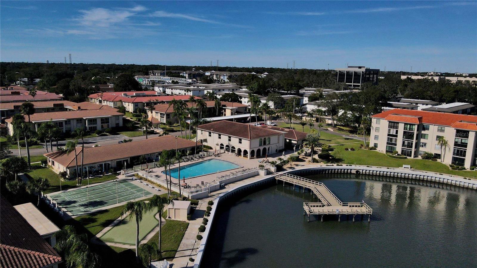 Pool and clubhouse view and view of Fishing pier in lagoon