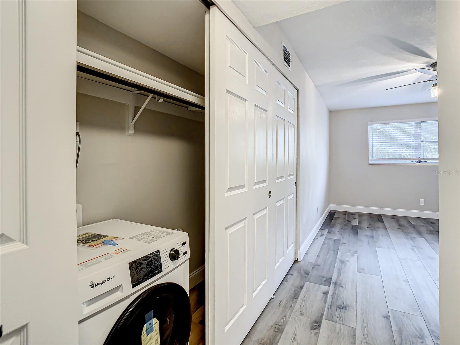 All-In-One Washer/Dryer machine in large primary bedroom closet