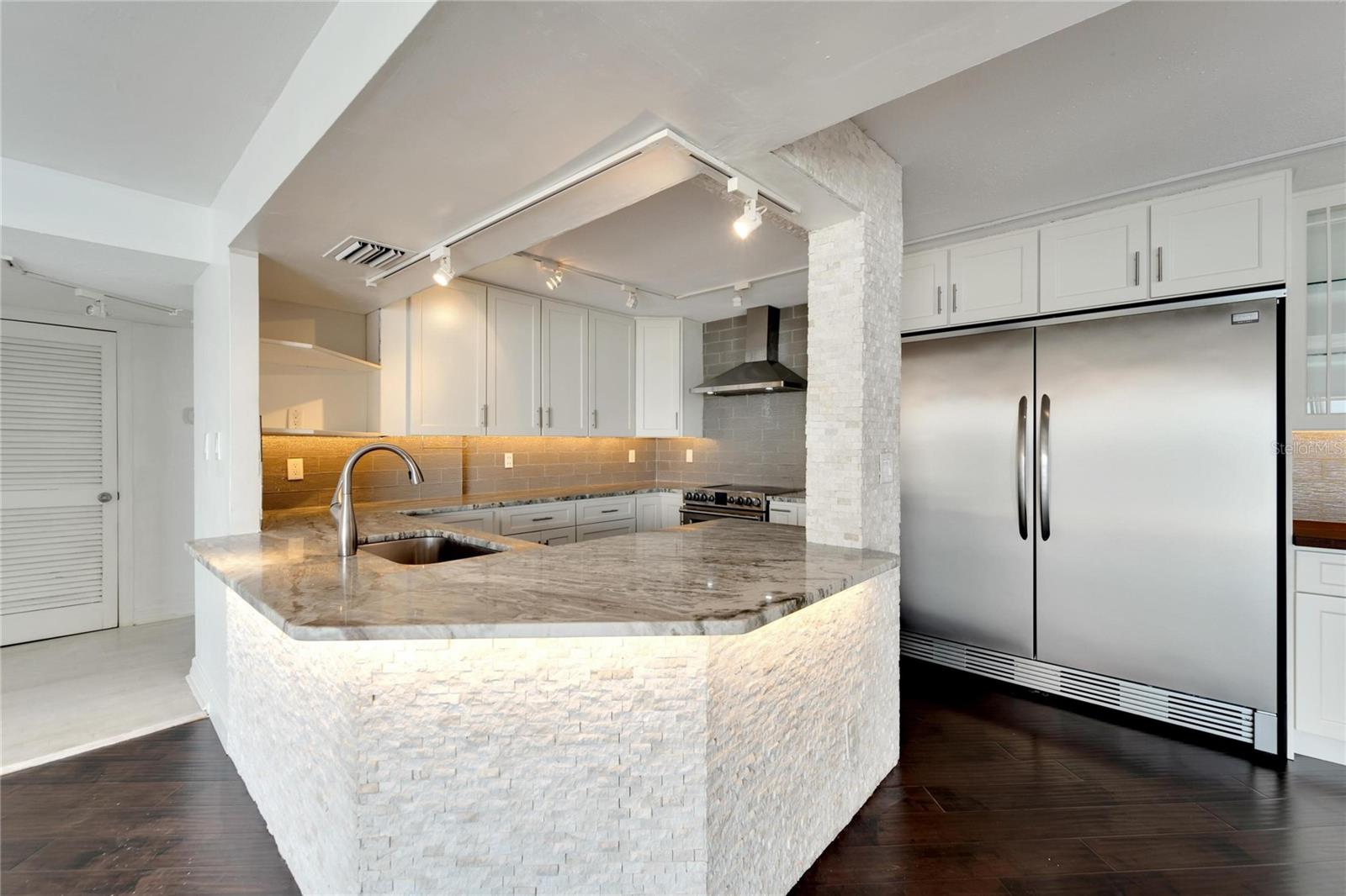 BEAUTIFULLY REDONE WITH ALL NEW COUNTERTOPS, CABINETRY, MODERN ACCENTS AND APPLIANCES
